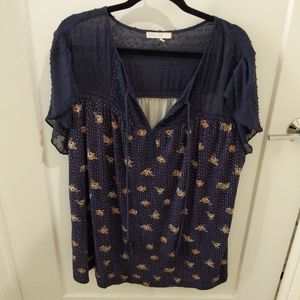 Blue flowy blouse with sheer shoulders and sleeves